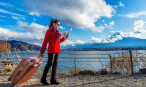 AAA Travel agent assisting travelers with vacation plans and destination options.