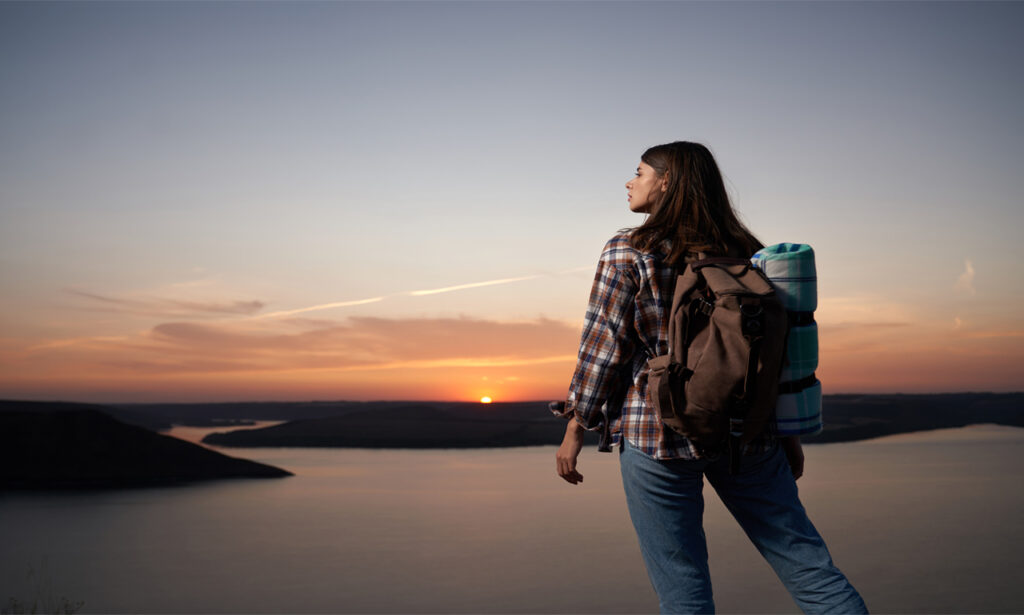 Solo traveler overlooking scenic landscape during an independent adventure.